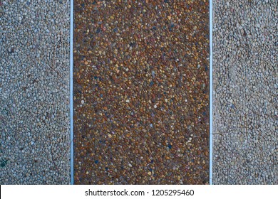 Texture of gravel's sidewalk or wall wich metal strips - Powered by Shutterstock