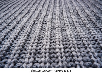 The Texture Of A Gray Knitted Woolen Jacket, Sweater.