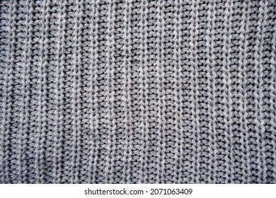 The Texture Of A Gray Knitted Woolen Jacket, Sweater.