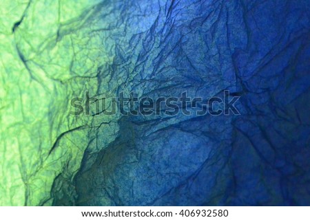 Texture of green and blue striped crumpled paper for pattern background