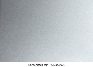 Texture of grey gradient matte metal background macro close up view