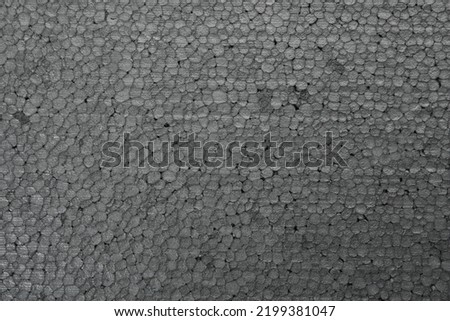Texture of grey styrofoam sheet as background, closeup