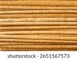 Texture of horizontal breadsticks. Thin long biscuits, straws.