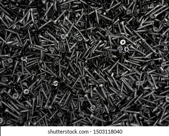 texture with a huge number of building screws located in one heap. View from above