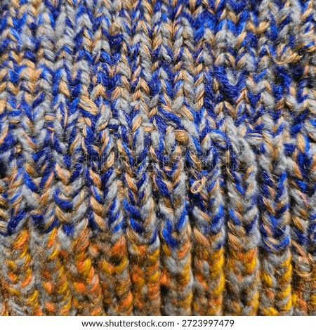 Texture of the interweaving colored wool threads in a sock. Background
