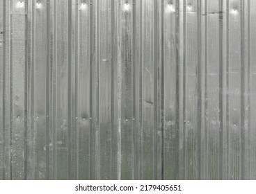 Texture Of Iron Metal Industrial Tin White Sheet Metal Profile With Vertical Boards For The Fence. The Background.