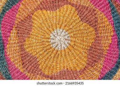 Texture of jute knitted rug (carpet) with characteristic traditional saturated colors