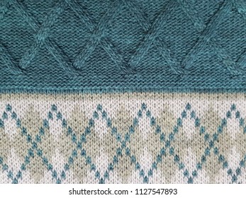 Texture of knitted fabric. Stranded threads. Cloth of warm winter clothes. Warm blanket. The texture of the green gray and black threads. Background. - Shutterstock ID 1127547893