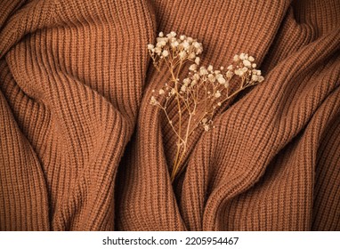 Texture Of A Knitted Wool Sweater In Brown Tones. Warm Cozy Autumn Background.