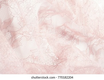 Texture lace fabric. lace on white background studio. thin fabric made of yarn or thread. typically one of cotton or silk, made by looping, twisting, or knitting thread in patterns