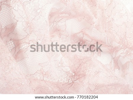 Texture lace fabric. lace on white background studio. thin fabric made of yarn or thread. typically one of cotton or silk, made by looping, twisting, or knitting thread in patterns