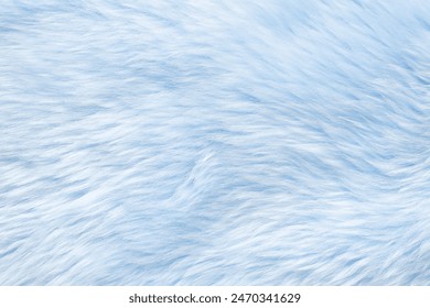 Texture of light blue faux fur as background, closeup
