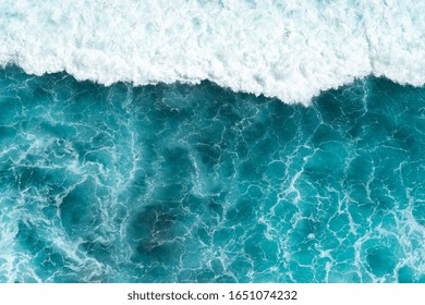 Texture Light blue surface of raging sea water with white foam and wave pattern - Powered by Shutterstock - Get 15% off with code: PIKWIZARD15