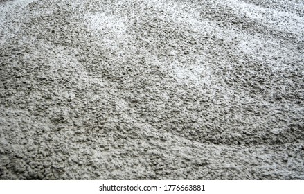Texture of liquid concrete in road construction site.
Thick and condensed concrete.