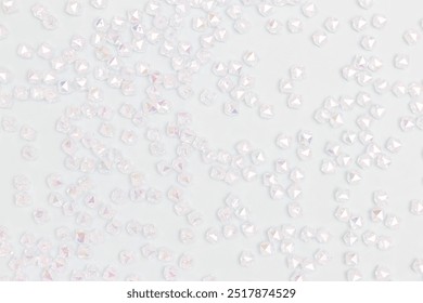 Texture made from iridescent acrylic beads scattered on a blue background. - Powered by Shutterstock