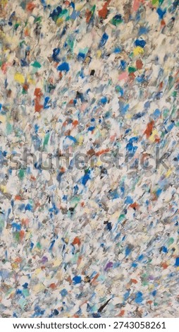 Texture made from recycled plastic, specifically from fused and pressed plastic waste granules, which is an eco-friendly approach to plastic waste disposal.