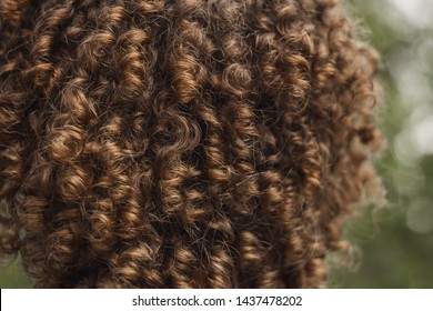 texture of male curly hair close up. perm for men. stylish hairdo.