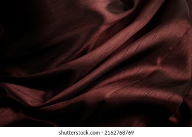 Texture of maroon silk fabric