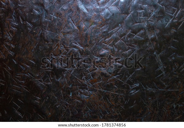 Texture of metal\
with dents from bumps close\
up