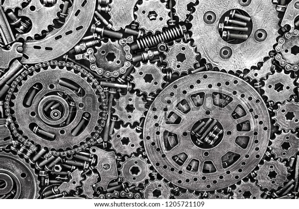 The texture\
of metal gears, bolts and screws, springs and metal parts on the\
wing of the car. Futuristic ancient vintage wall with mechanisms in\
the steampunk style.\
Background