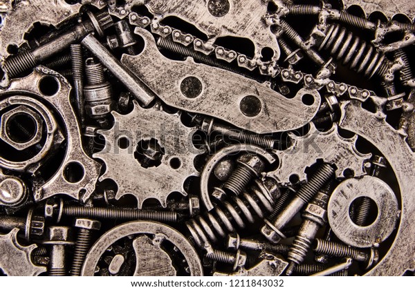 The\
texture of metal gears, bolts and screws, springs and metal parts\
on the wing of the car. Futuristic ancient vintage wall with\
mechanisms in the steampunk style. Background\
