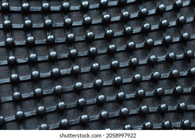Texture: metal iron grating, grid or stainless steel grate on black background. Venting, ventilation with geometric pimpled design pattern