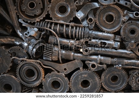texture metal junk nuts bolts wires and other spare parts piled in a mix of metal debris with gears and rust abstract image