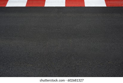 Texture Of Motor Race Asphalt And Red White Curb On Grand Prix Street Circuit