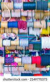 Texture of multi-colored threads. Motley background. Textile products.