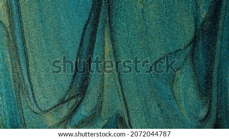 Texture of nail polish. Beautiful turquoise stains of liquid nail polish. Concept of fashion and beauty industry. Close-up