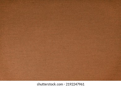 Texture of natural brown fabric or cloth. Fabric texture diagonal weave of natural cotton or linen textile material. Blue canvas background. Decorative fabric for curtain, furniture, walls, clothes
