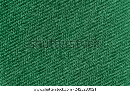 Texture of natural green twill fabric close-up. the background for your mockup