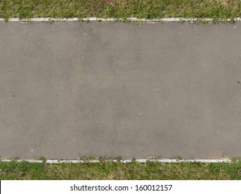 Texture of new, asphalt road in grey tone with grass at edges. - Powered by Shutterstock