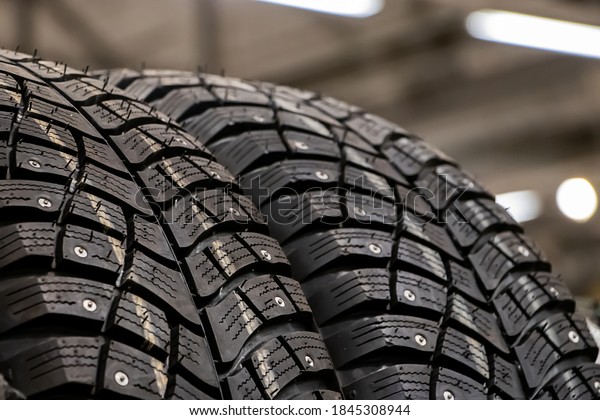 Texture of a new\
winter tires for car\
closeup.