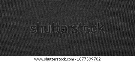 The texture of nylon black fabric.Synthetic black nylon fabric. The background is nylon black.