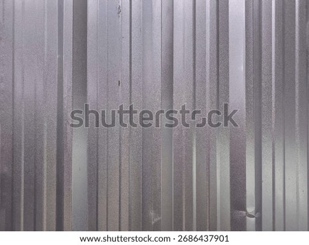 Texture of an old metal rolling shutter door. Backgrounds, textures, or design elements related to urban decay, construction, or street photography themes