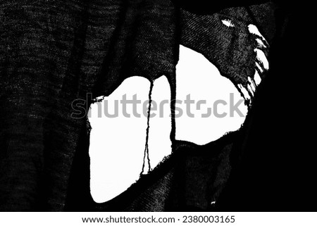 Texture of an old ragged cloth with empty copy space, white fabric with big hole and shredded threads. cotton fabric, ripped open hole at center of a textile pattern. hole in the tissue. loose threads