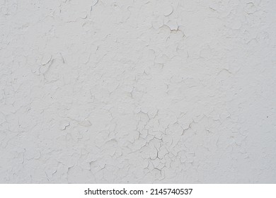 The texture of an old rundown wall with cracks