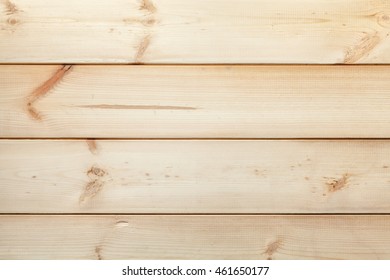 The texture of the old rustic gnarled planks. Wooden light vintage background.