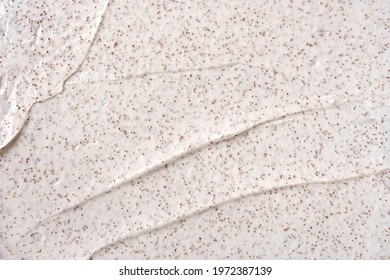 Texture of organic white scrub with Exfoliating coffee particles. Close-up