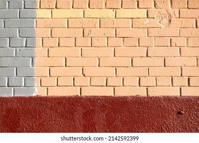Texture painted brick. Stonework. Architecture details. Different colors on wall.