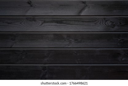 The texture of painted ebony. Black wood planks horizontally - Shutterstock ID 1766498621