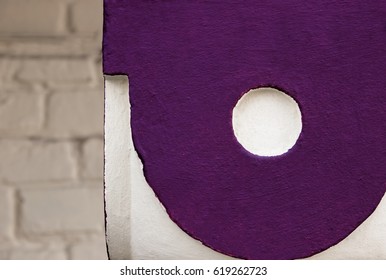 Texture, pattern, background. Concrete wall, paint abstractly against the background of concrete, bright purple circles with a beige-milky shade of paint in the background. Background beige brick.