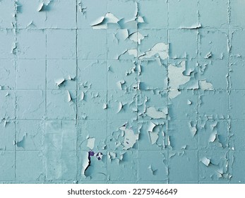 Texture, pattern, background. old paint. Concrete wall cracked paint, paint abstractly behind the concrete. With white tone paint flakes off over time. Peeling painted wall background.