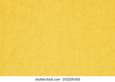 The texture and pattern of the old light brown fabric is blurry.
