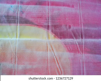 Texture and pattern of the pink plastic sheet for a tablecloth.