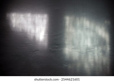 The texture and pattern of the reflection of sunlight from the water onto the white wall