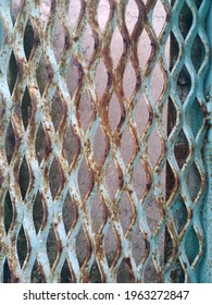 The Texture Of A Patterned Green Fence. Content Contains Chrominance Noise, Luminance Noise, Sharpening Noise, Or Film Grain