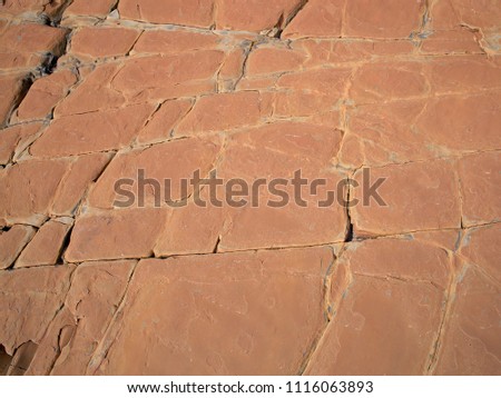 Texture and patterns of red natural boulder; brown boulder, texture of rock, texture of brown and red stone; hard stony surface 