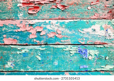 Texture peeling paint background, horizontal old wooden planks with peeling paint of turquoise color